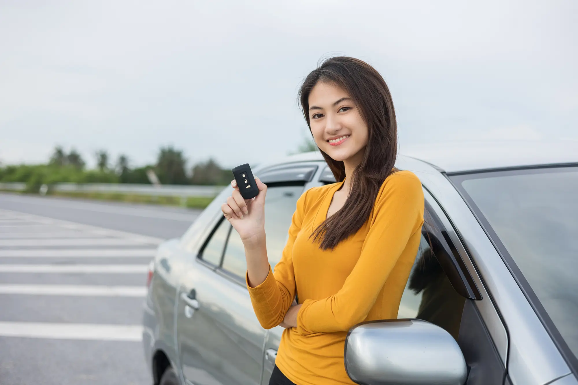 Woman holding car key