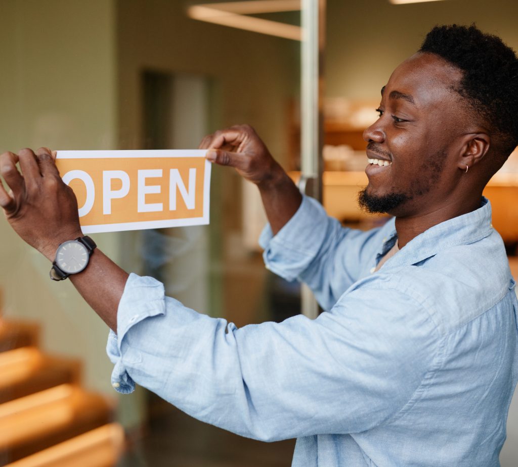 Man with open sign